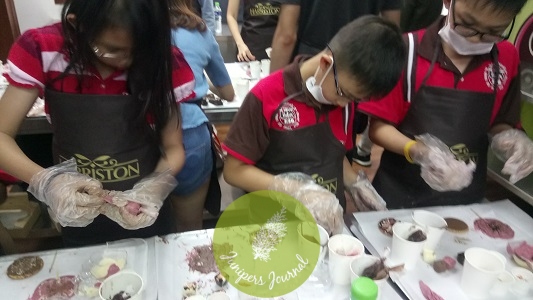 Kids unleash their creativity during the chocolate workshop at Harriston Signatue