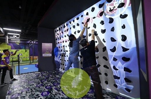 Participants test their agility and skills against the Augmented Climbing Wall as they race to score as many points as they can by tapping the virtual bats